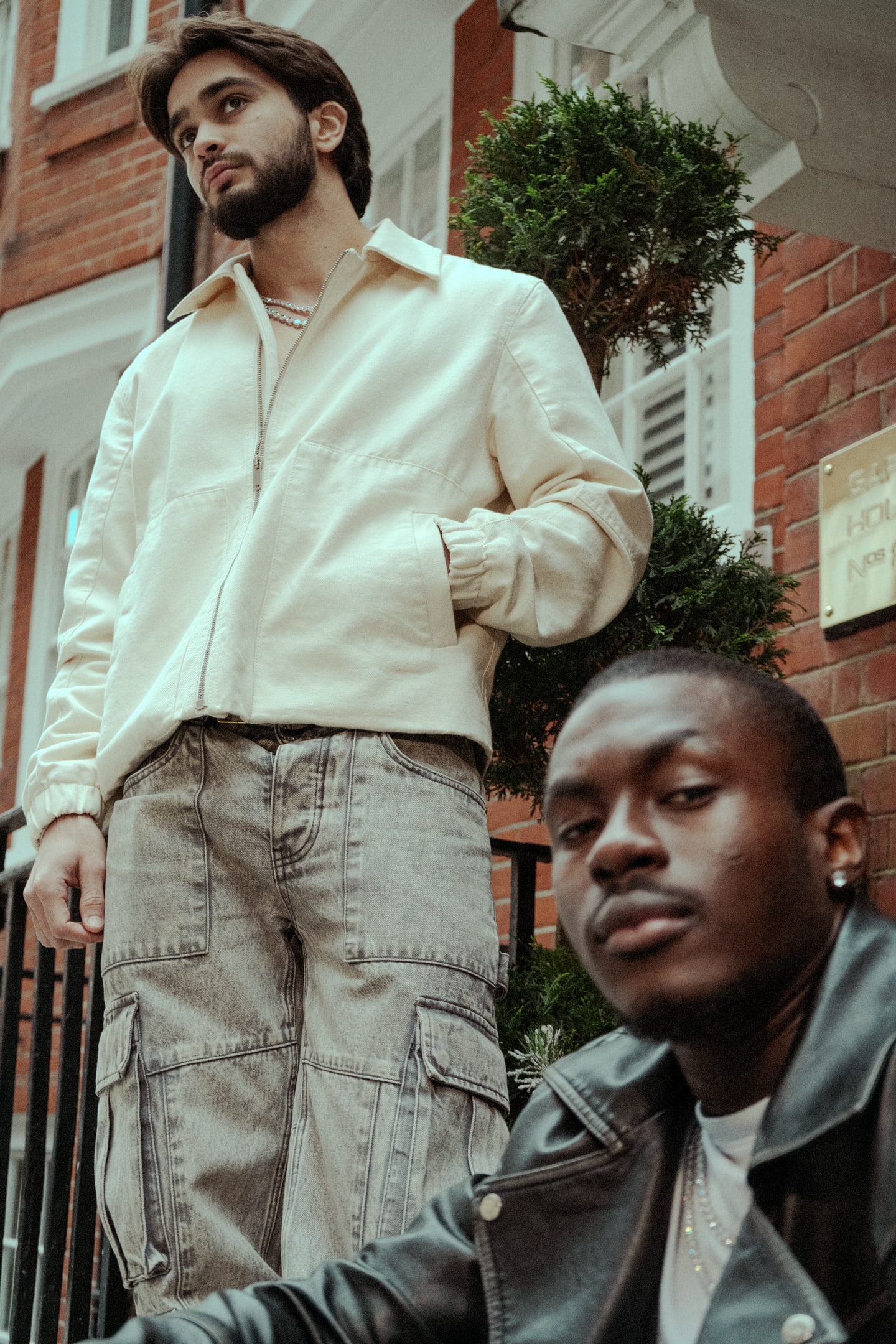 Two-model fashion portrait on a city street
